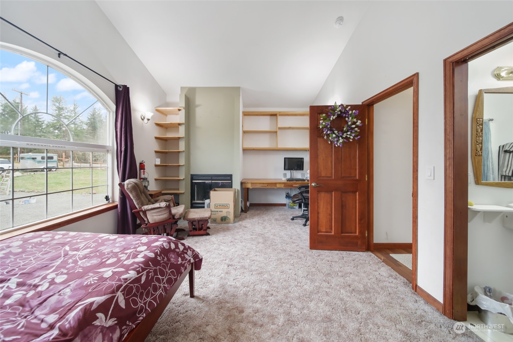 17141 Longmire Road Southeast Yelm, WA 98597 - Photo 15 of 29 a bedroom with furniture and large windows