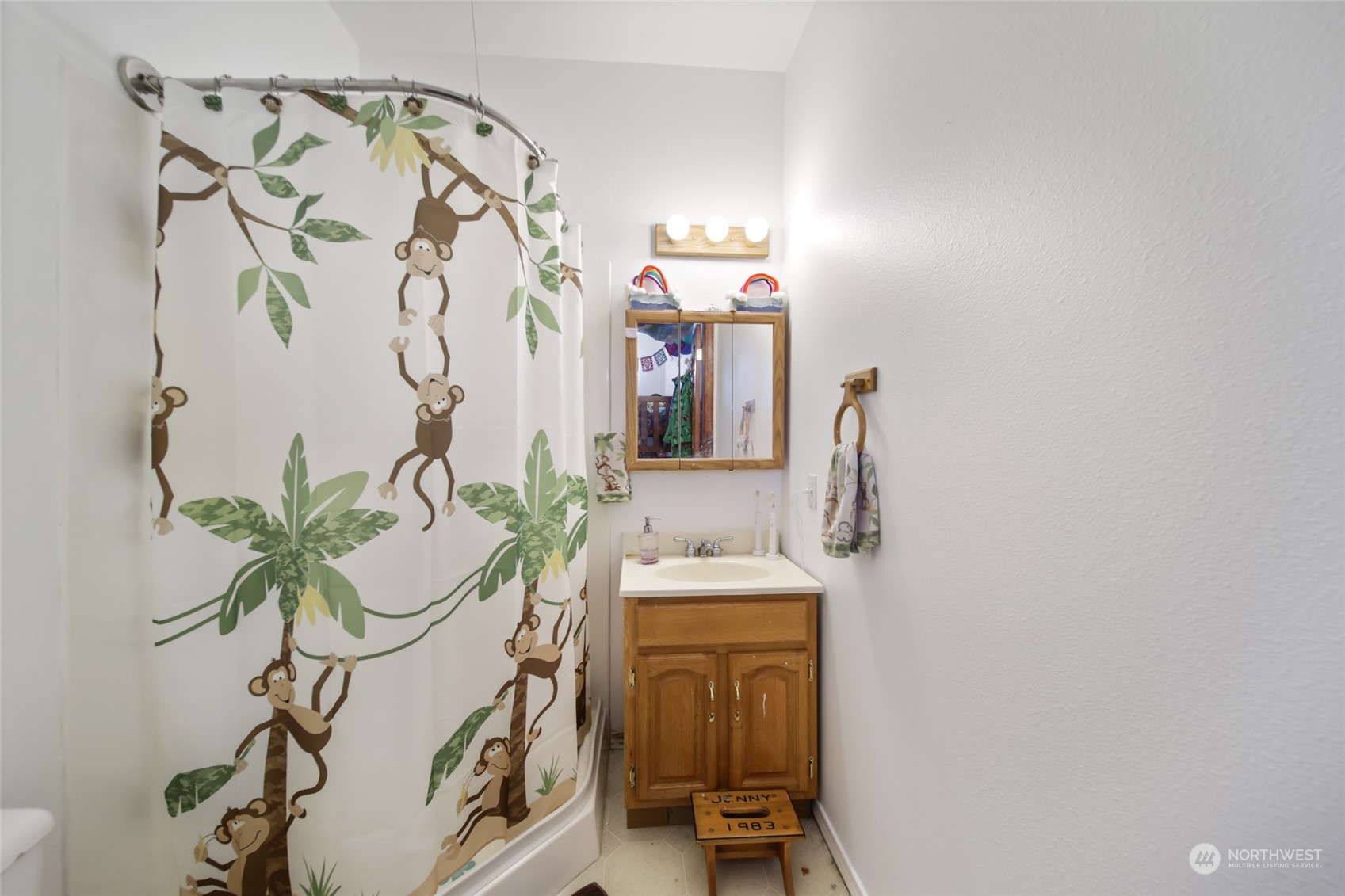 17141 Longmire Road Southeast Yelm, WA 98597 - Photo 18 of 29 a bathroom with a sink and mirror with painted walls