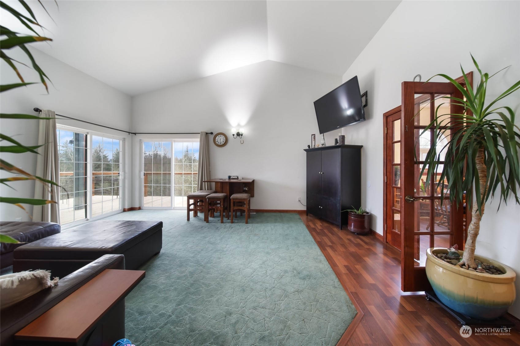 17141 Longmire Road Southeast Yelm, WA 98597 - Photo 19 of 29 a living room with furniture and a floor to ceiling window