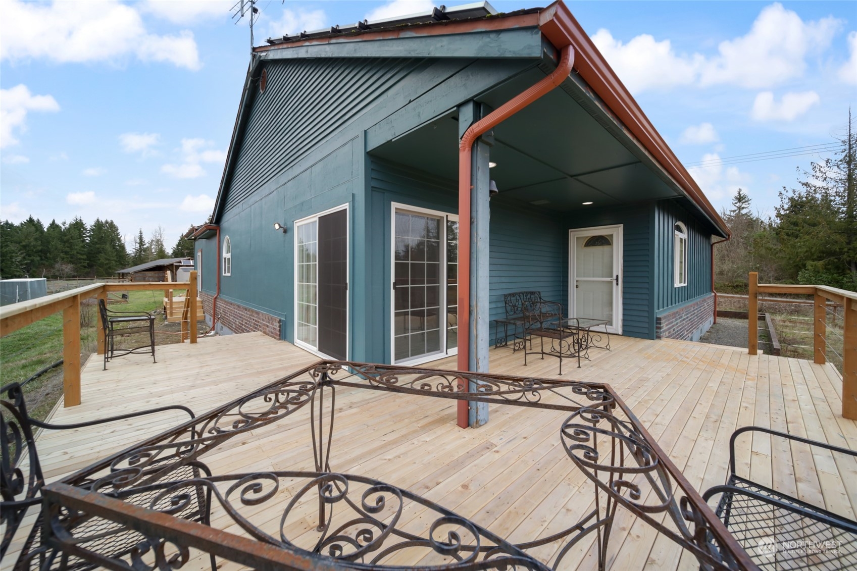 17141 Longmire Road Southeast Yelm, WA 98597 - Photo 23 of 29 a view of a dinning table and chairs in the patio