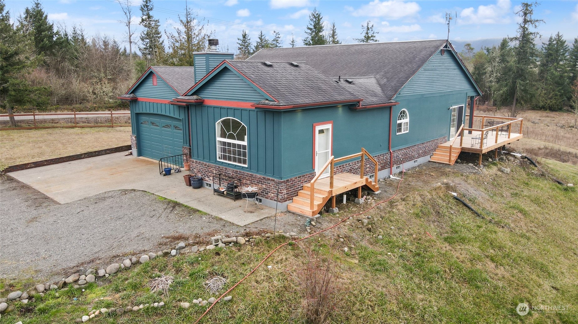 17141 Longmire Road Southeast Yelm, WA 98597 - Photo 24 of 29 a front view of a house with a yard