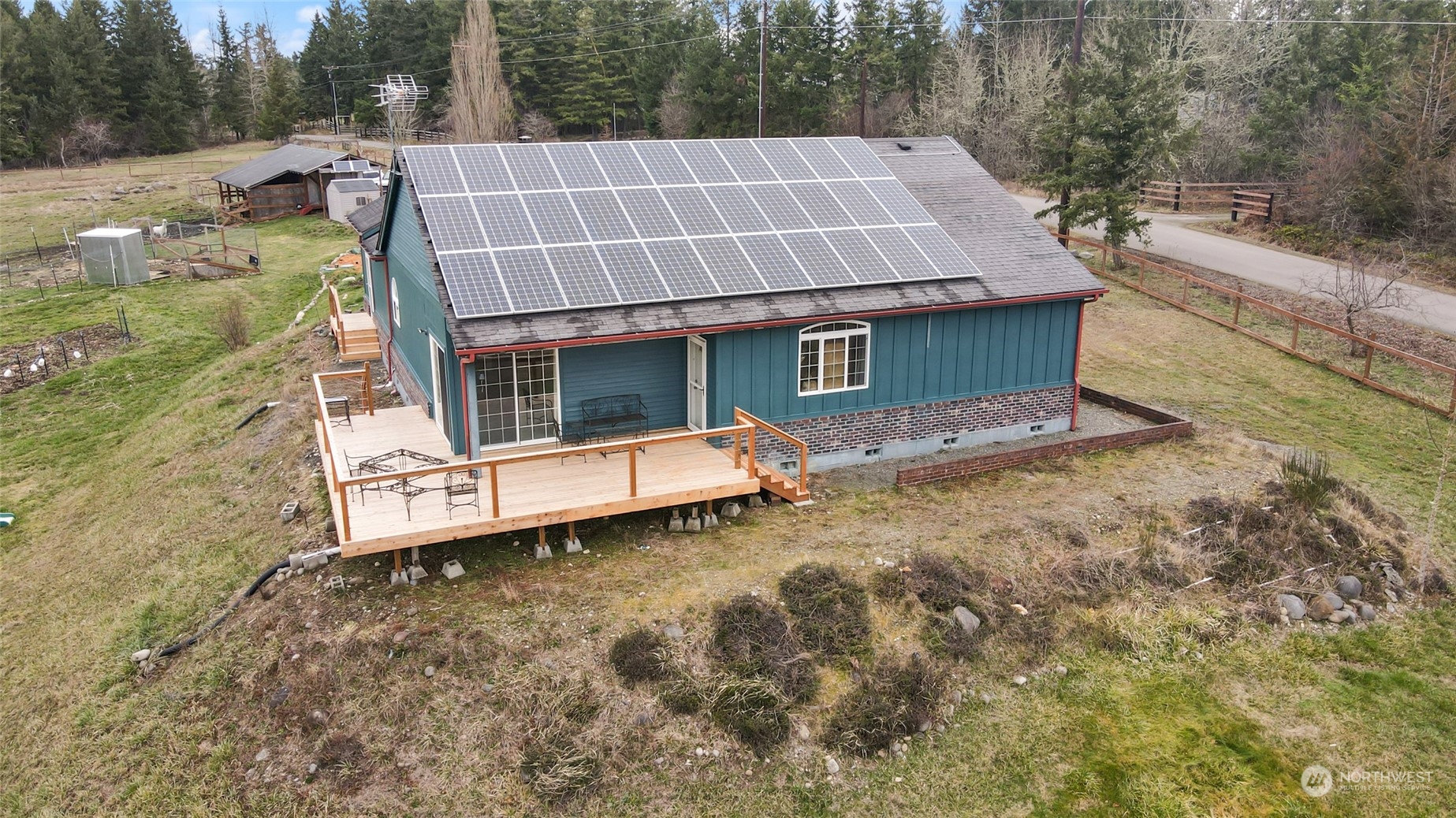 17141 Longmire Road Southeast Yelm, WA 98597 - Photo 29 of 29 a aerial view of a house with a yard and sitting area