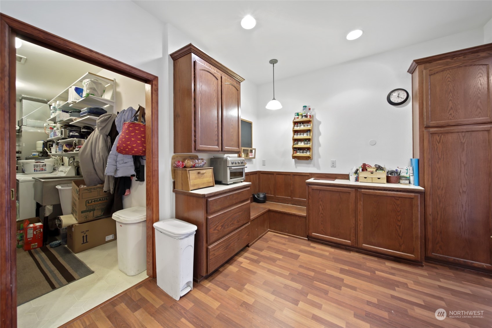17141 Longmire Road Southeast Yelm, WA 98597 - Photo 4 of 29 a kitchen with stainless steel appliances kitchen island granite countertop a refrigerator a sink and wooden floors