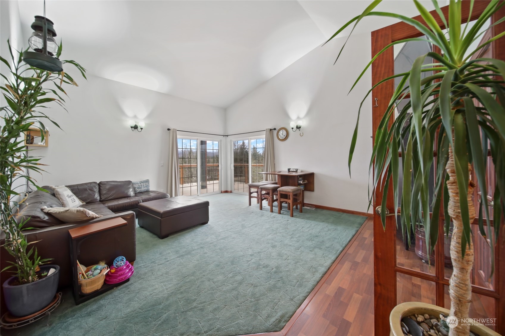 17141 Longmire Road Southeast Yelm, WA 98597 - Photo 5 of 29 a living room with furniture and a potted plant