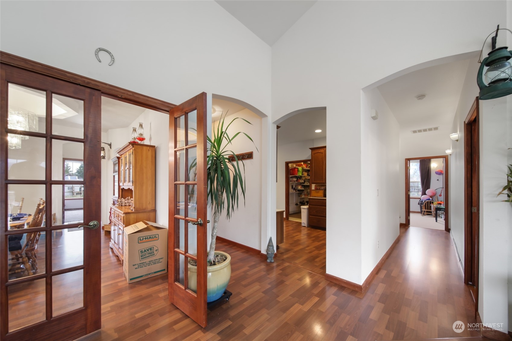 17141 Longmire Road Southeast Yelm, WA 98597 - Photo 8 of 29 a view of a hallway with wooden floor and entryway