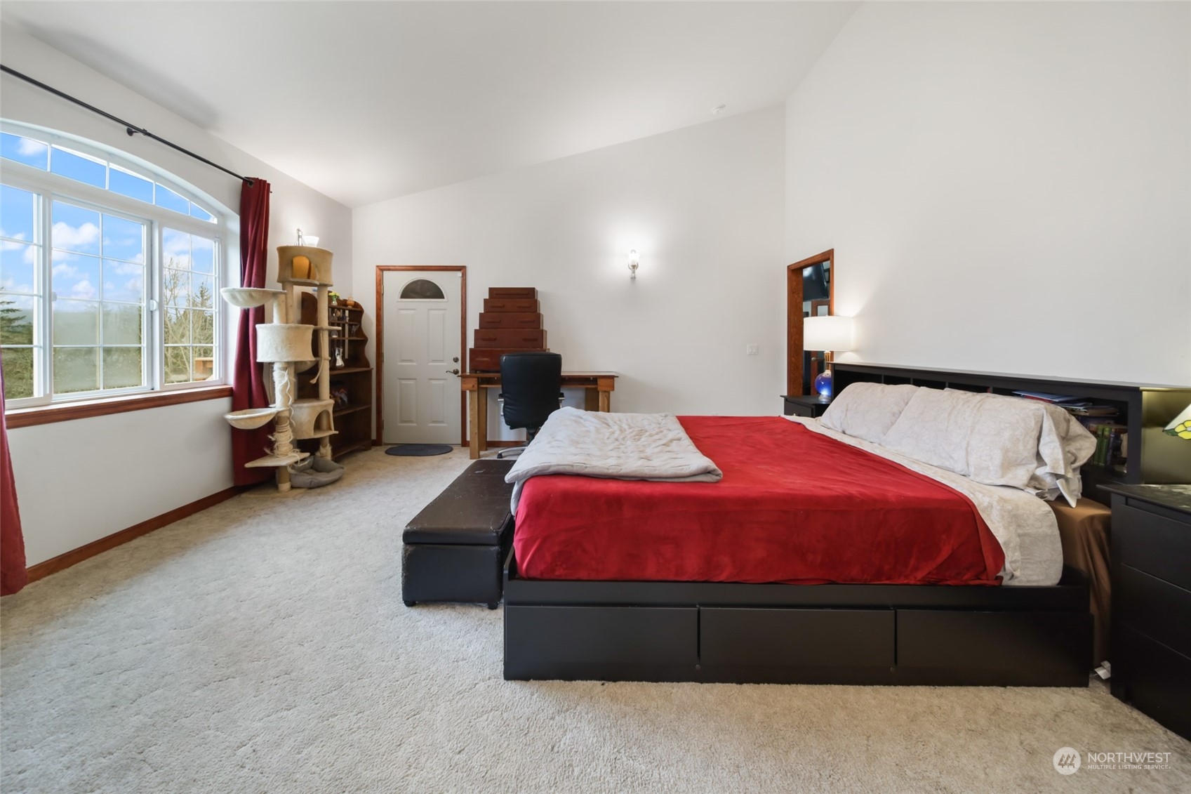 17141 Longmire Road Southeast Yelm, WA 98597 - Photo 10 of 29 a bed room with a bed and a large window