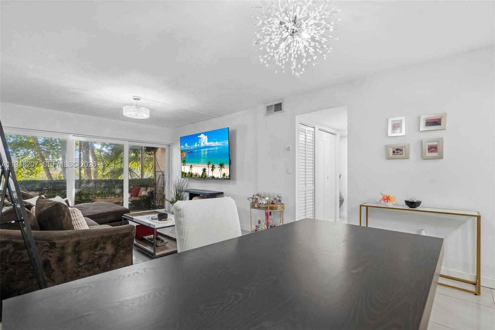 469 North Pine Island Road, Unit B302 Plantation, FL 33324 - Photo 13 of 33 a living room with furniture and a large window