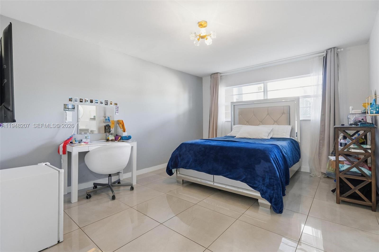 469 North Pine Island Road, Unit B302 Plantation, FL 33324 - Photo 18 of 33 a bedroom with a bed and a chair