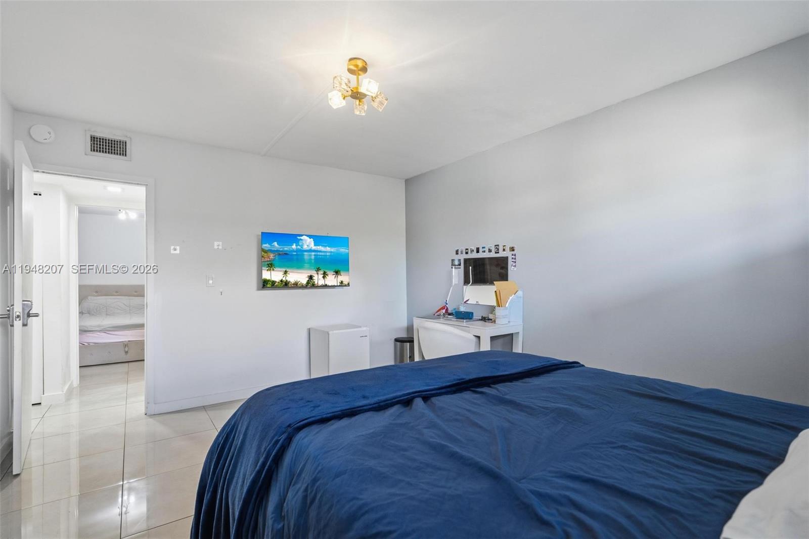 469 North Pine Island Road, Unit B302 Plantation, FL 33324 - Photo 20 of 33 a bedroom with a bed and a desk