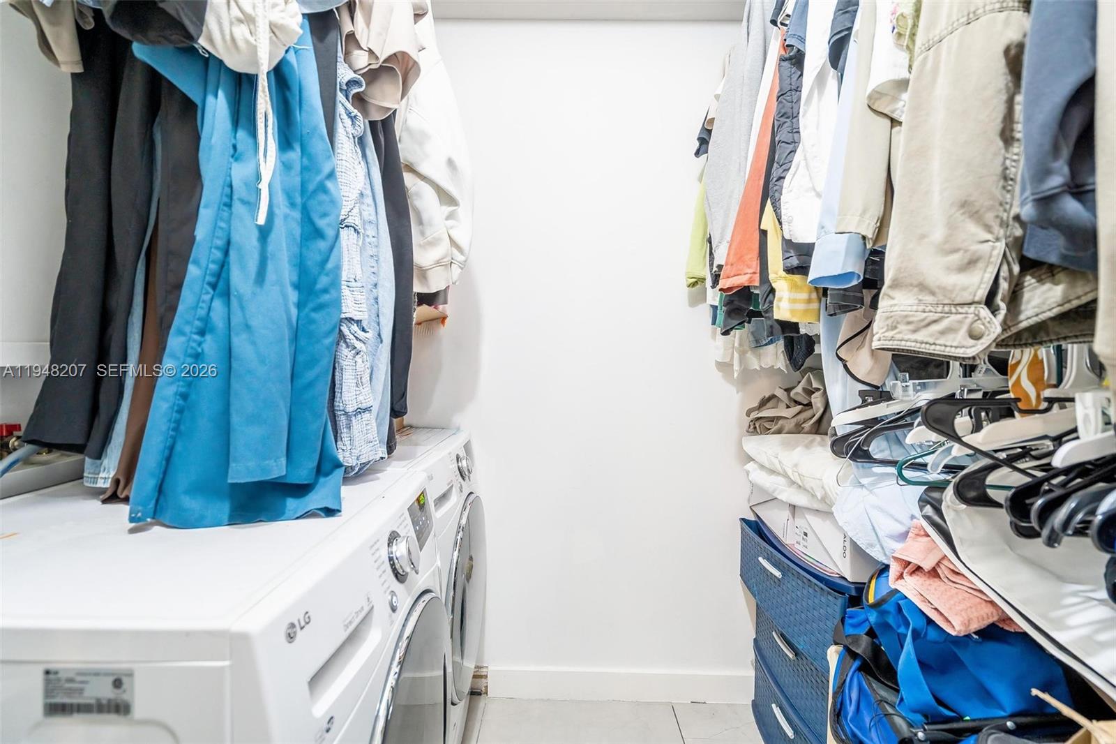 469 North Pine Island Road, Unit B302 Plantation, FL 33324 - Photo 24 of 33 a view of walk in closet with clothes and shoes