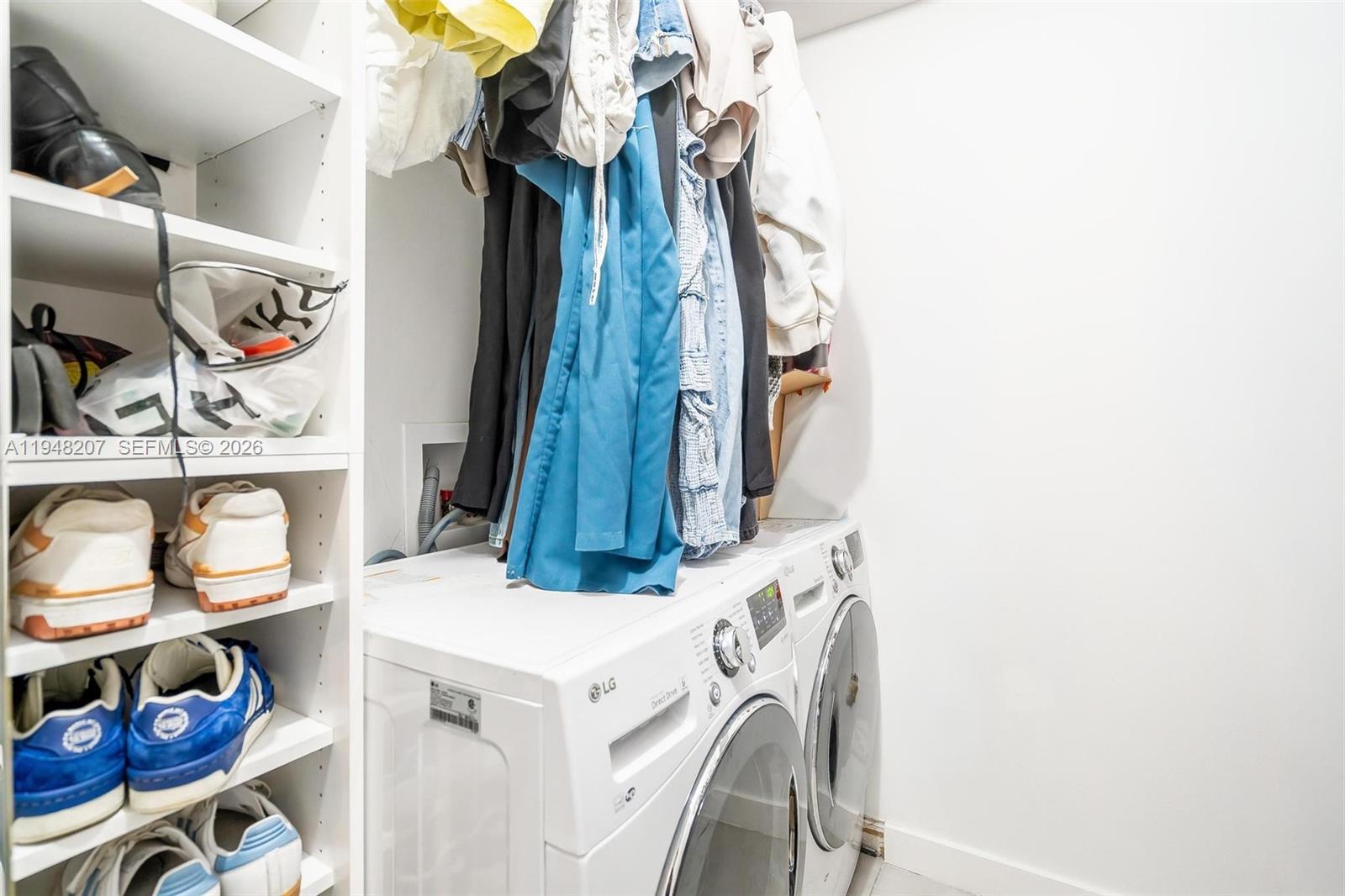 469 North Pine Island Road, Unit B302 Plantation, FL 33324 - Photo 25 of 33 a view of walk in closet with clothes and shoes