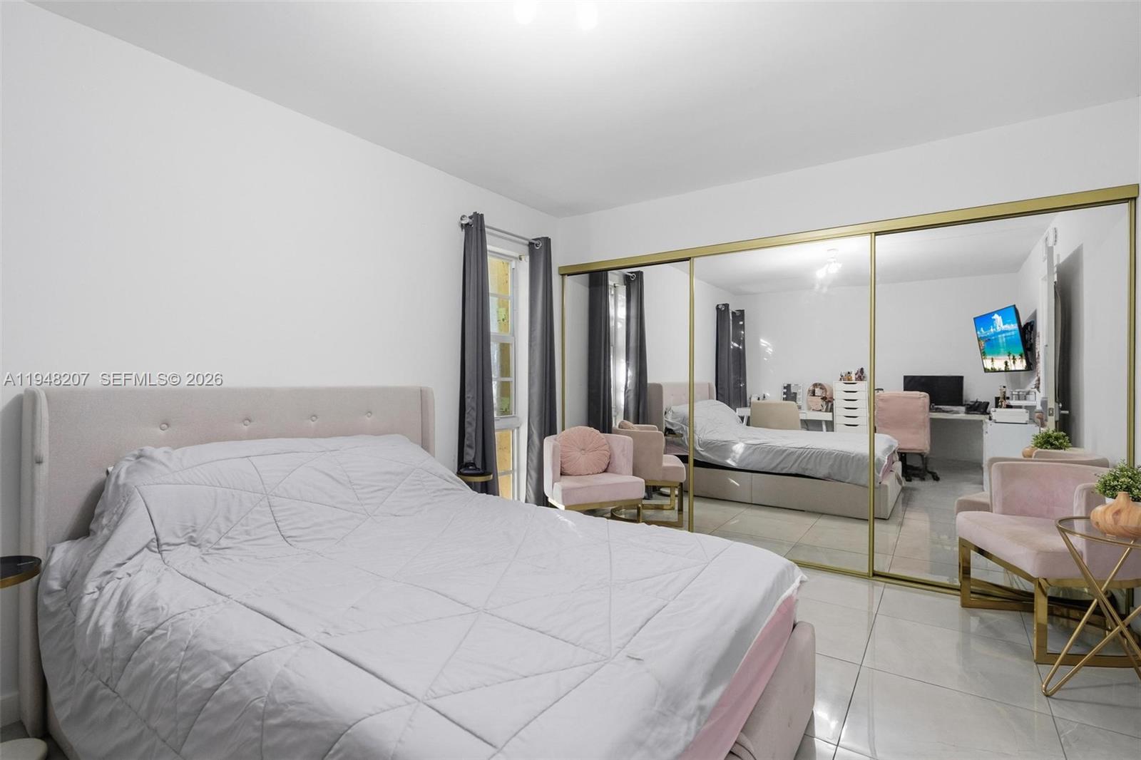 469 North Pine Island Road, Unit B302 Plantation, FL 33324 - Photo 26 of 33 a large white bed in a room and a mirror