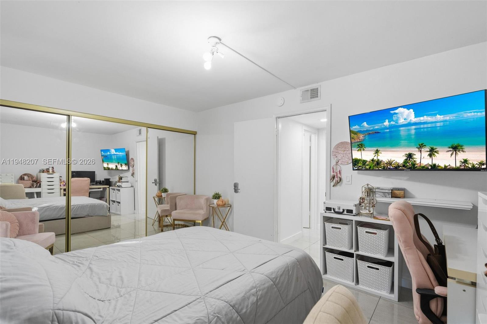 469 North Pine Island Road, Unit B302 Plantation, FL 33324 - Photo 27 of 33 a bedroom with a bed a desk and painting on the wall