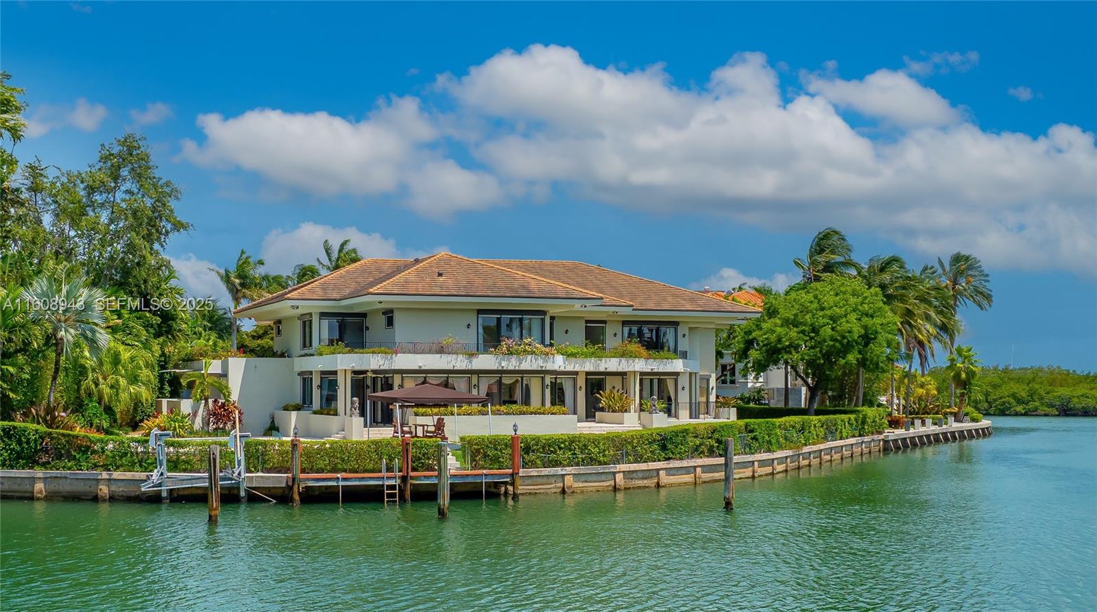 241 Cape Florida Drive Key Biscayne, FL 33149 - Photo 2 of 100 a view of a house with a yard