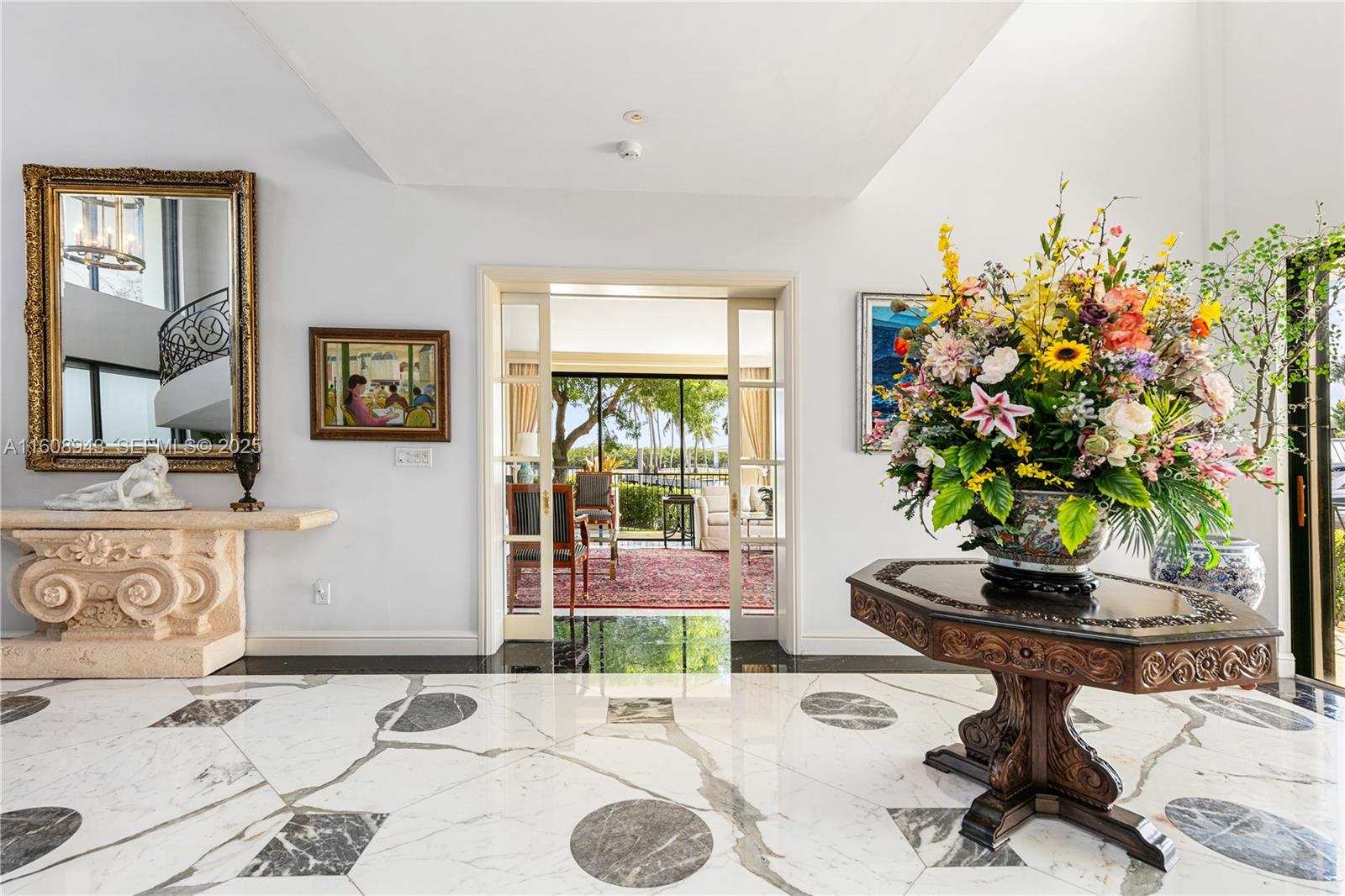241 Cape Florida Drive Key Biscayne, FL 33149 - Photo 21 of 100 a living room with furniture and a potted plant
