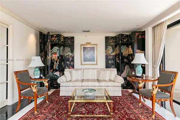 a living room with furniture and a table