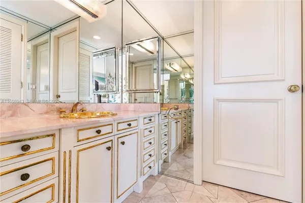 a white bath tub sitting next to a shower