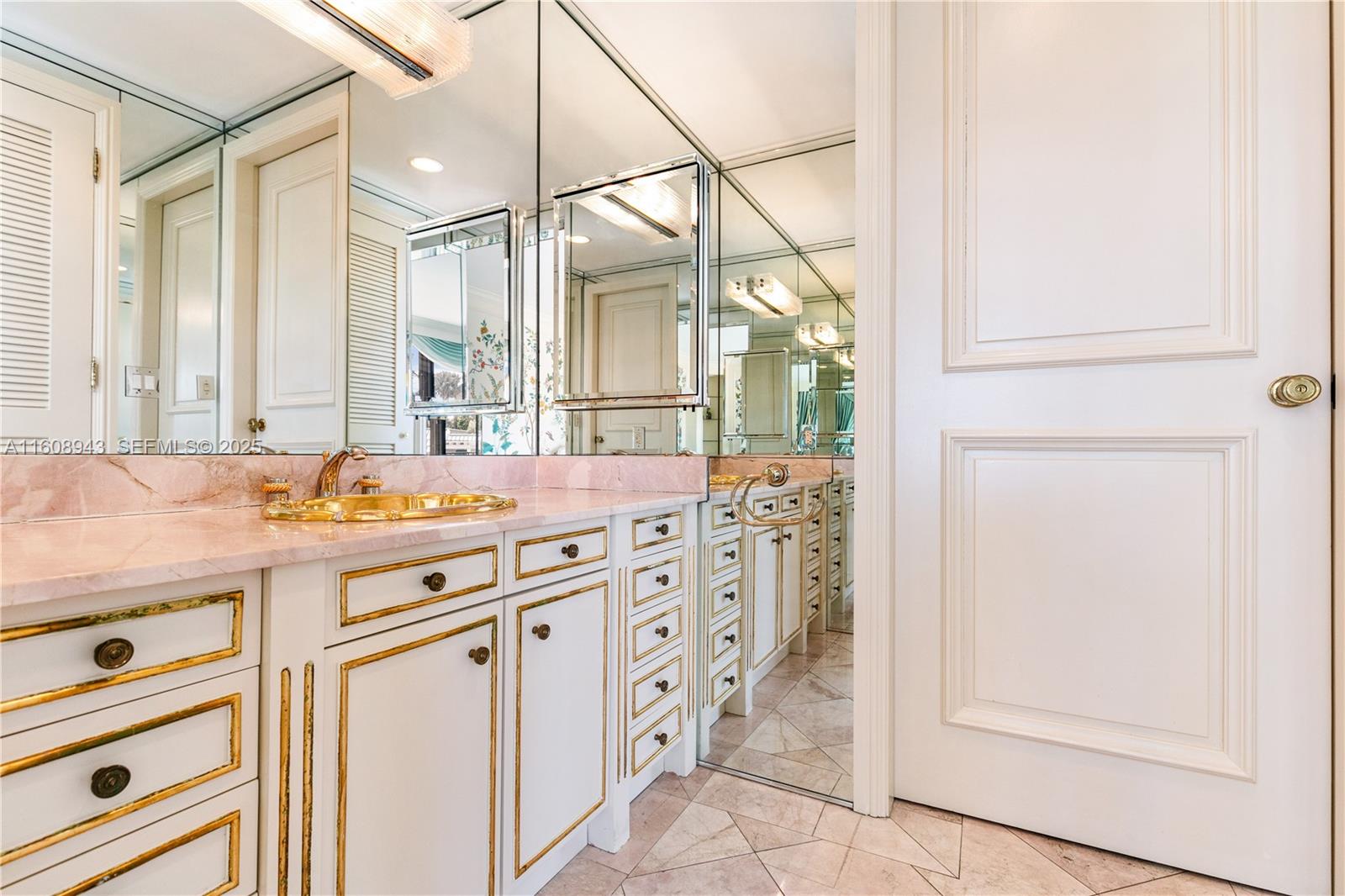 241 Cape Florida Drive Key Biscayne, FL 33149 - Photo 29 of 100 a bathroom with a granite countertop sink and a mirror