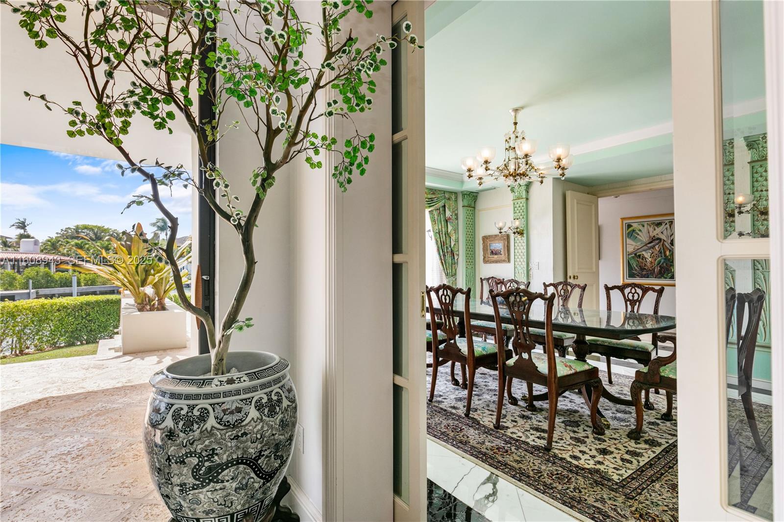 241 Cape Florida Drive Key Biscayne, FL 33149 - Photo 31 of 100 a view of a dining room with furniture and chandelier