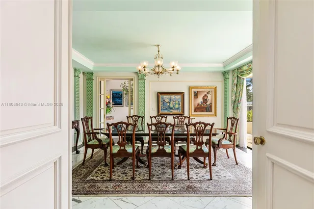a living room with furniture and a painting on the wall