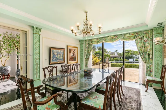 a large bedroom with a bed and glass window