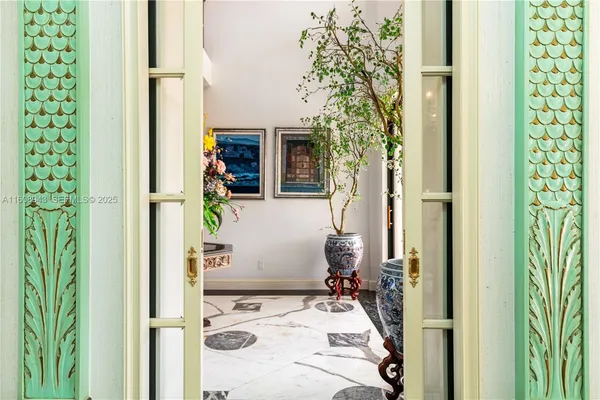 a dining room with wooden floor and glass door
