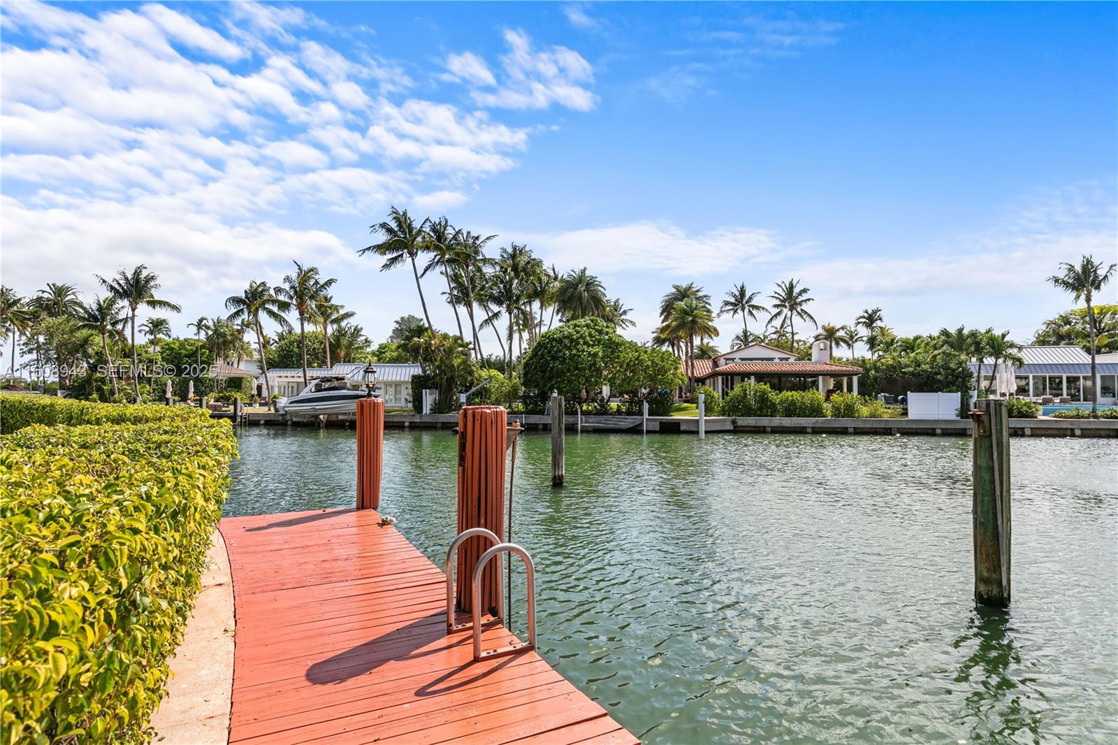 241 Cape Florida Drive Key Biscayne, FL 33149 - Photo 47 of 100 a view of a lake with boats and trees in the background