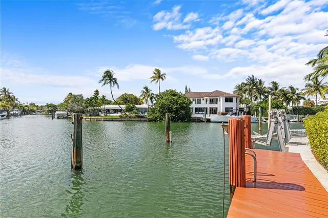 an aerial view of a house with outdoor space lake view and boat
