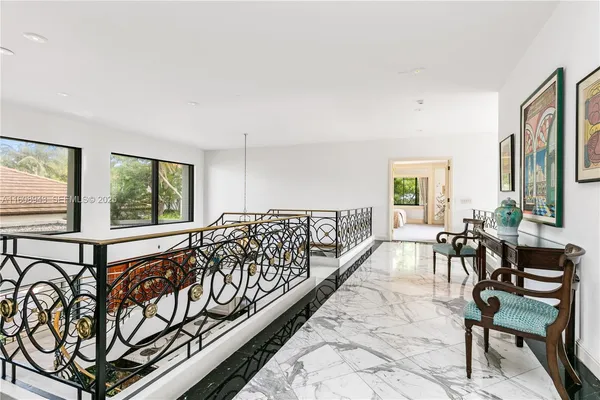 a view of a patio with table and chairs with wooden fence