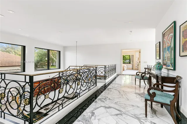 a view of a patio with table and chairs with wooden fence