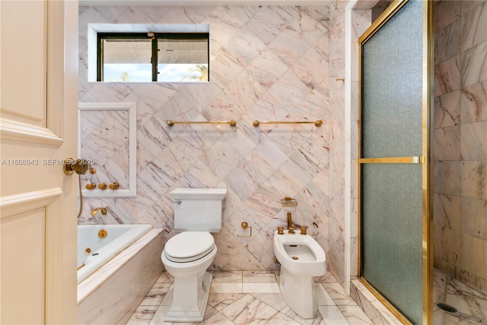 241 Cape Florida Drive Key Biscayne, FL 33149 - Photo 60 of 100 a bathroom with a toilet sink and shower