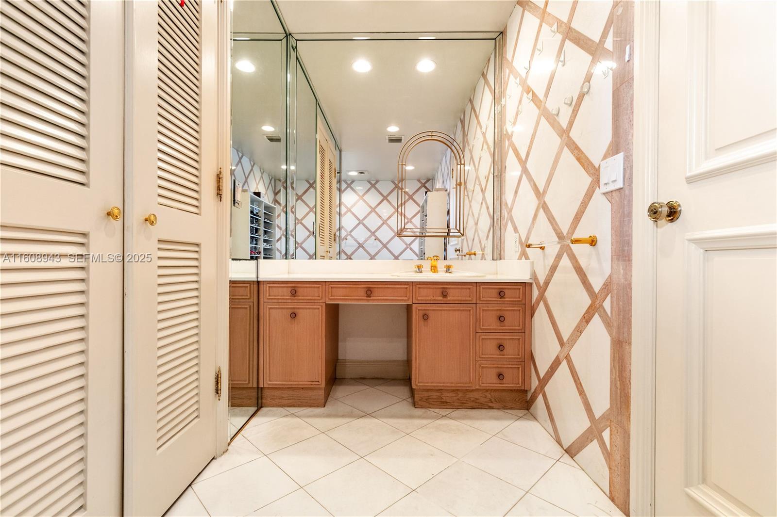 241 Cape Florida Drive Key Biscayne, FL 33149 - Photo 70 of 100 a bathroom with a sink vanity and a mirror