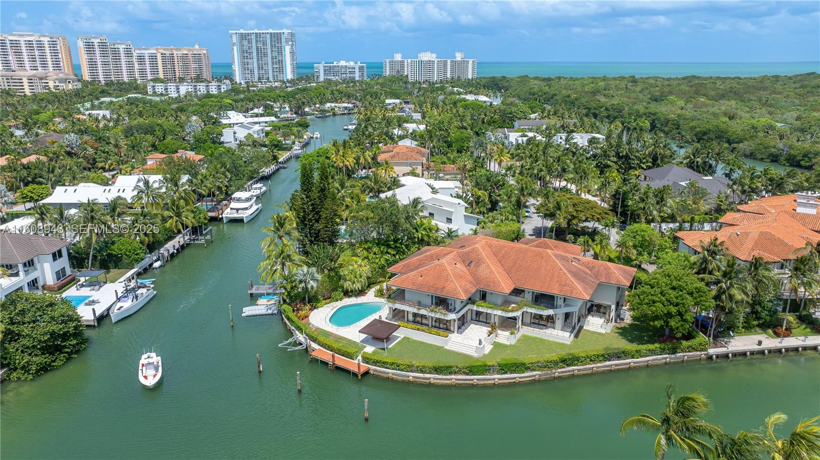 241 Cape Florida Drive Key Biscayne, FL 33149 - Photo 94 of 100 a view of a lake with a mountain