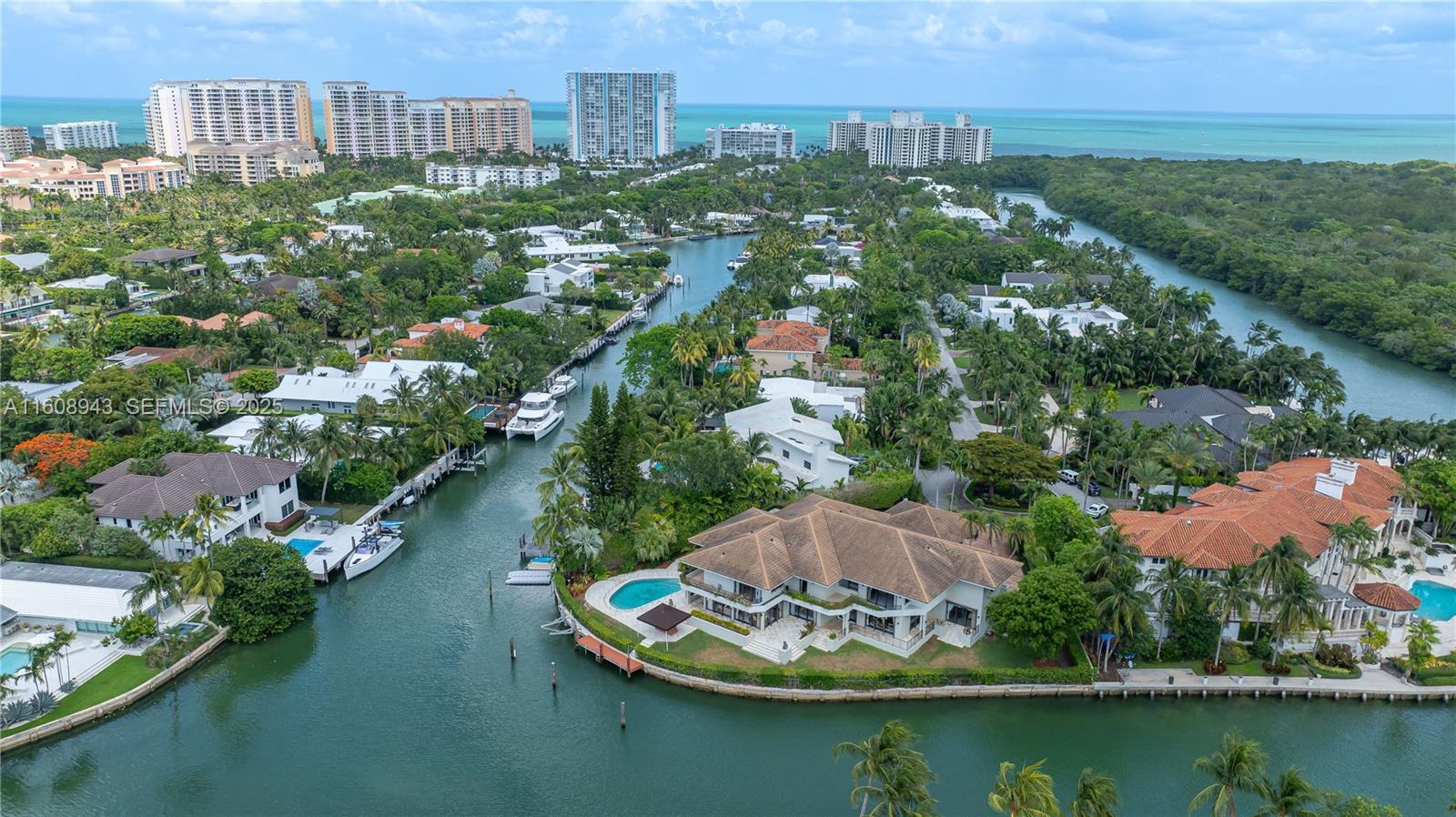 241 Cape Florida Drive Key Biscayne, FL 33149 - Photo 97 of 100 an aerial view of a house with a yard lake and city view
