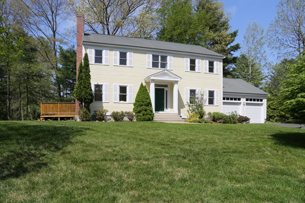 3 E Road Wayland, MA 01778 - Photo 1 of 24 a front view of a house with a yard and trees