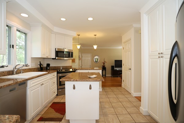 3 E Road Wayland, MA 01778 - Photo 11 of 24 a kitchen with stainless steel appliances granite countertop a refrigerator and a sink