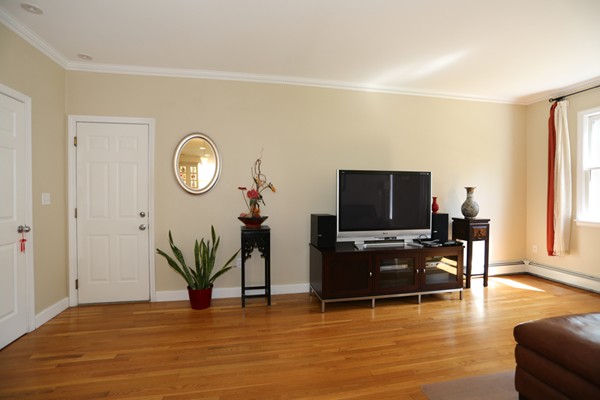 3 E Road Wayland, MA 01778 - Photo 14 of 24 a living room with furniture and a flat screen tv