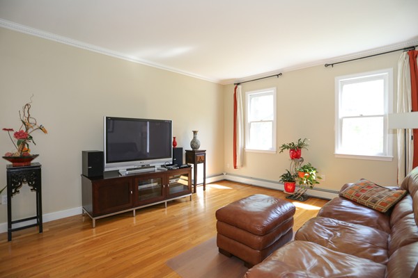 3 E Road Wayland, MA 01778 - Photo 15 of 24 a living room with furniture and a flat screen tv