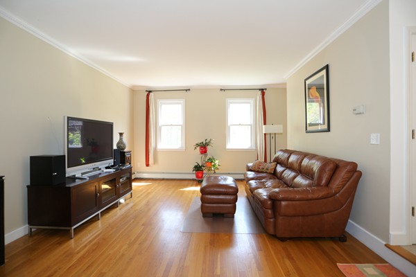 3 E Road Wayland, MA 01778 - Photo 16 of 24 a living room with furniture and a flat screen tv