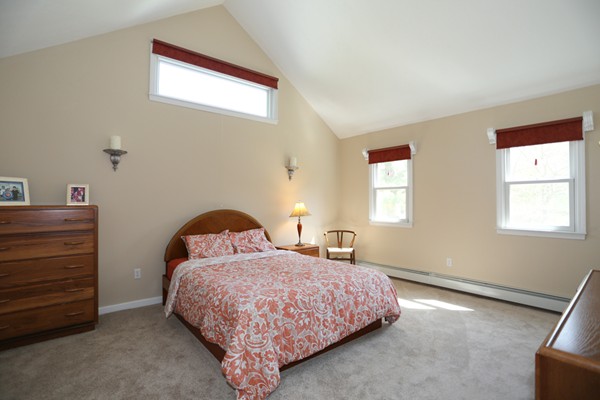 3 E Road Wayland, MA 01778 - Photo 18 of 24 a bedroom with a bed and a window