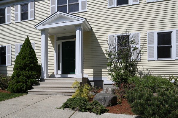 3 E Road Wayland, MA 01778 - Photo 2 of 24 a front view of a house with a yard