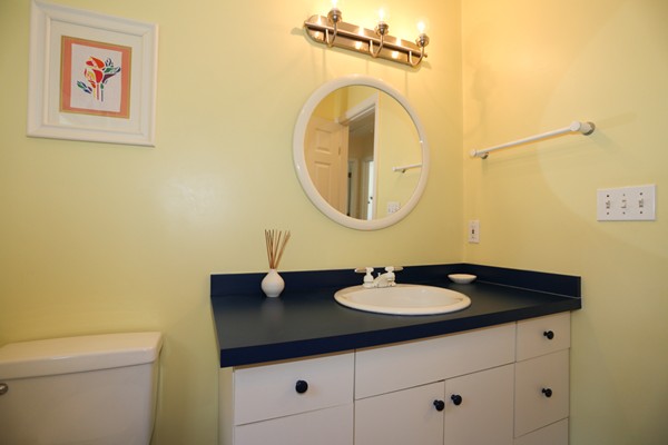 3 E Road Wayland, MA 01778 - Photo 22 of 24 a bathroom with a sink and a mirror