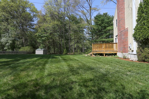 3 E Road Wayland, MA 01778 - Photo 24 of 24 a front view of a house with a yard