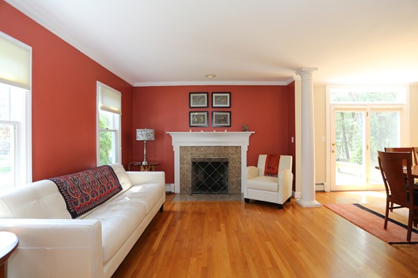 3 E Road Wayland, MA 01778 - Photo 4 of 24 a living room with furniture and a fireplace