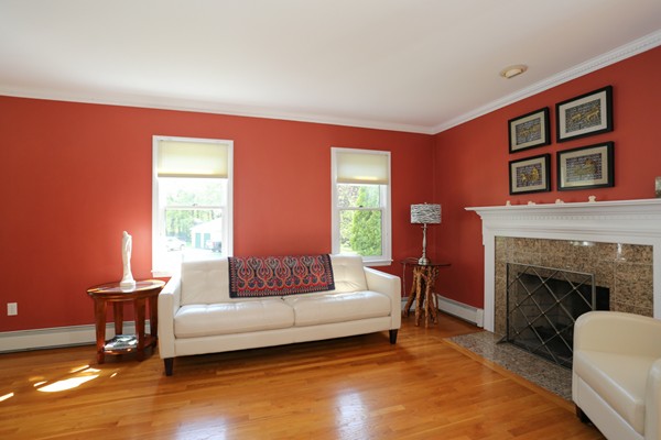 3 E Road Wayland, MA 01778 - Photo 5 of 24 a living room with furniture and a fireplace