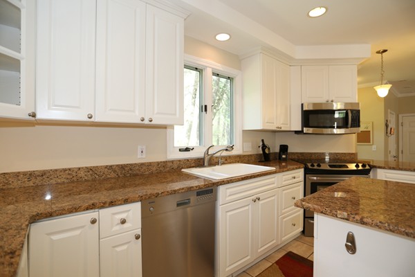 3 E Road Wayland, MA 01778 - Photo 10 of 24 a kitchen with granite countertop a sink stove and cabinets