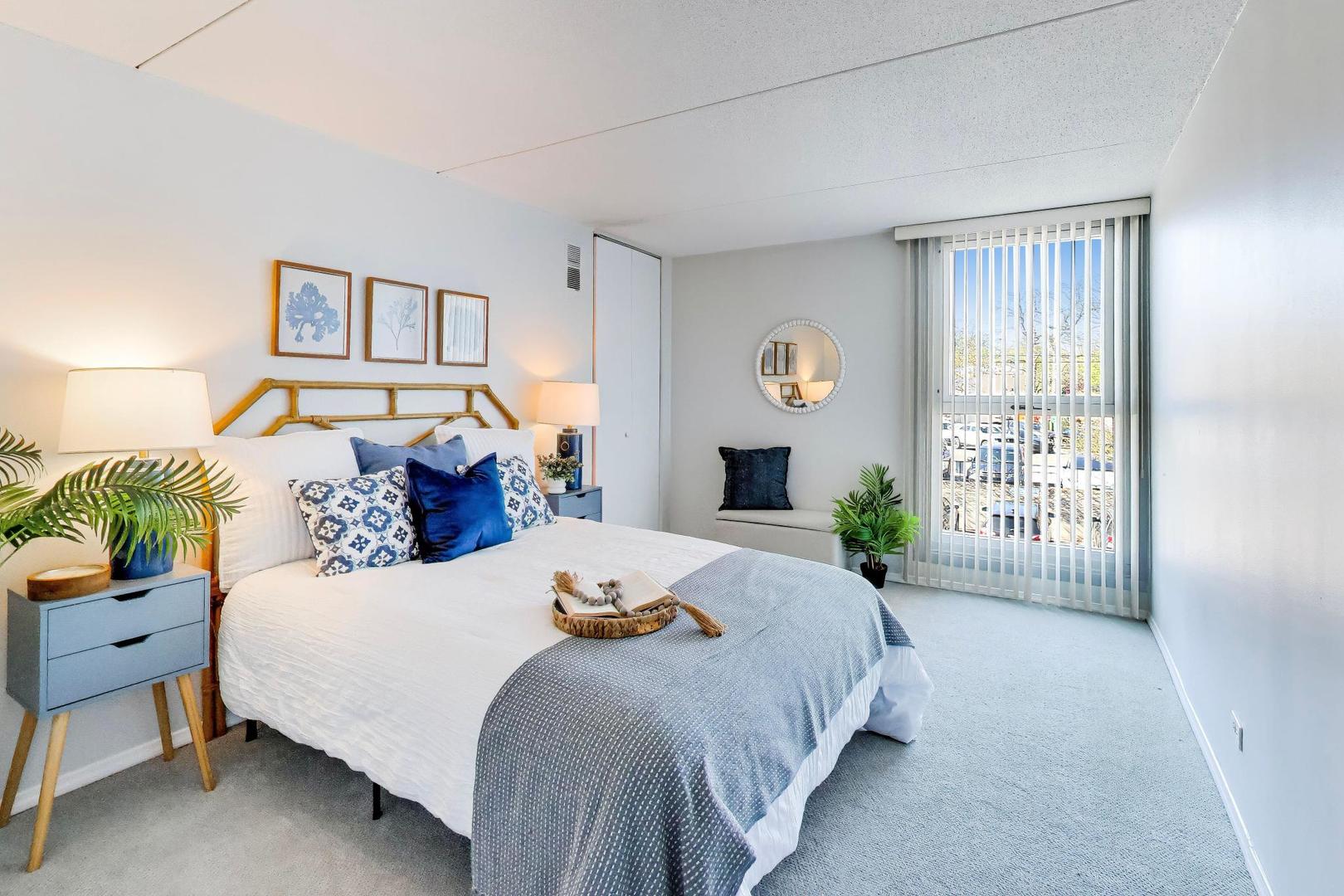 1625 Sheridan Road, Unit 213 Wilmette, IL 60091 - Photo 14 of 18 a bedroom with a bed and a couch