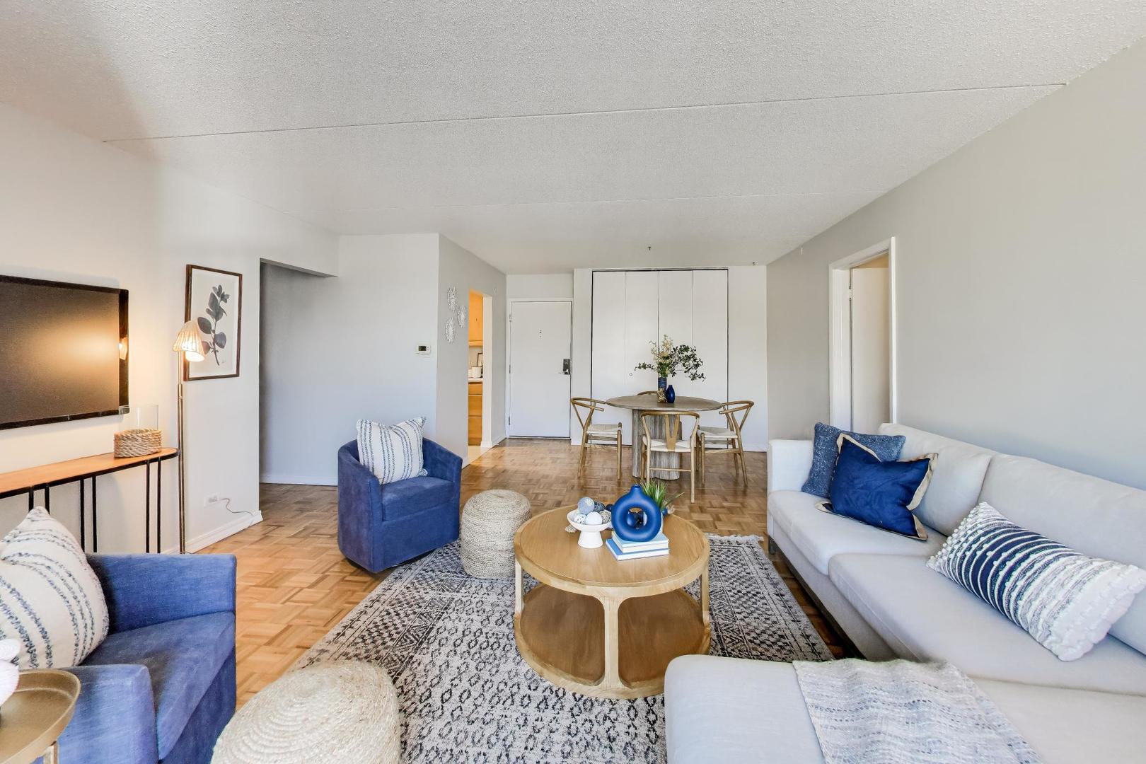 1625 Sheridan Road, Unit 213 Wilmette, IL 60091 - Photo 5 of 18 a living room with furniture or couch and a flat screen tv
