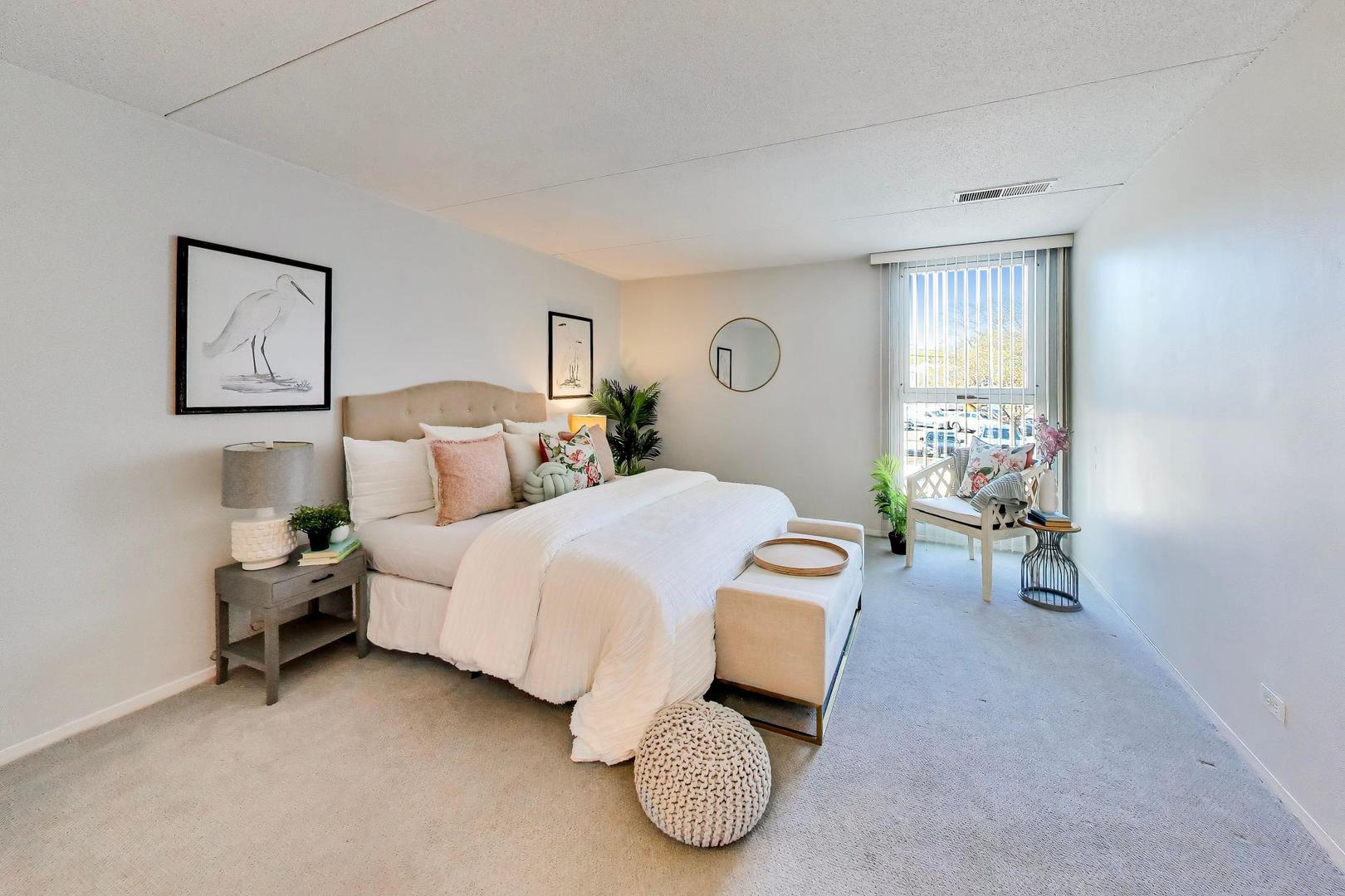 1625 Sheridan Road, Unit 213 Wilmette, IL 60091 - Photo 10 of 18 a bedroom with a bed and a window