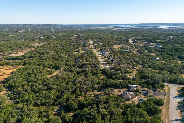 an aerial view of residential houses with outdoor and green space